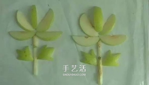 Simple pear handicraft method for children to use fruits to spell flowers