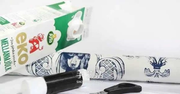 Milk cartons are made into a pen holder/storage box that can be carried