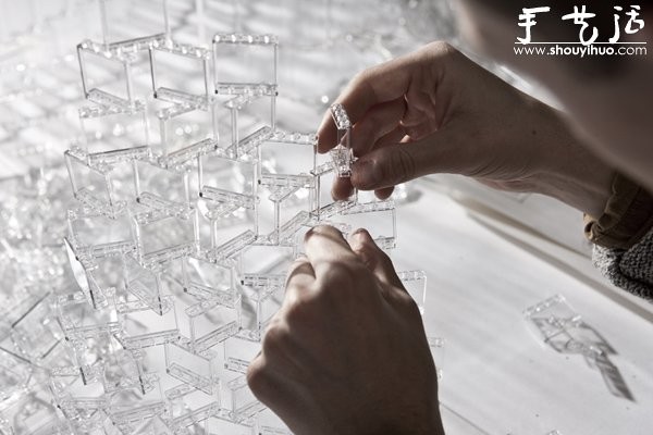 A giant chandelier made of transparent Lego bricks