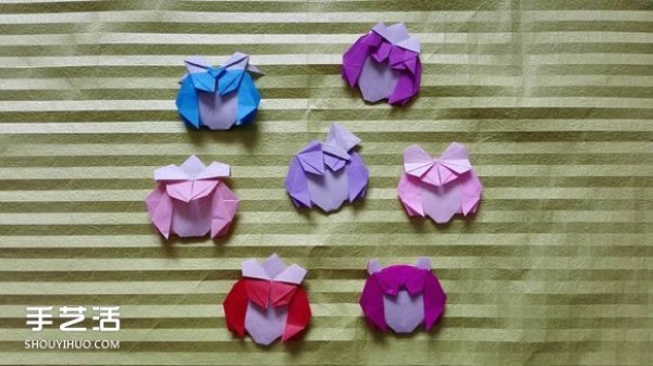 Handmade origami girls head illustration, step-by-step folding method for a girl with short hair