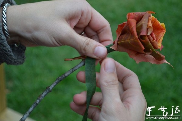 Handmade roses with fiery red maple leaves