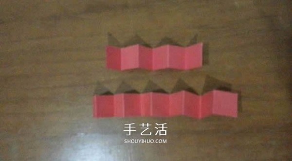 Illustration of the steps of hand-made origami Snapology ball using paper strips to make a sphere