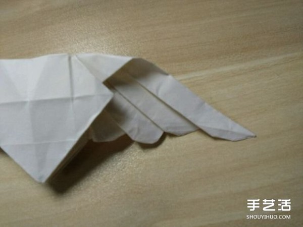 Flying origami heart with steps to fold a heart-shaped with wings