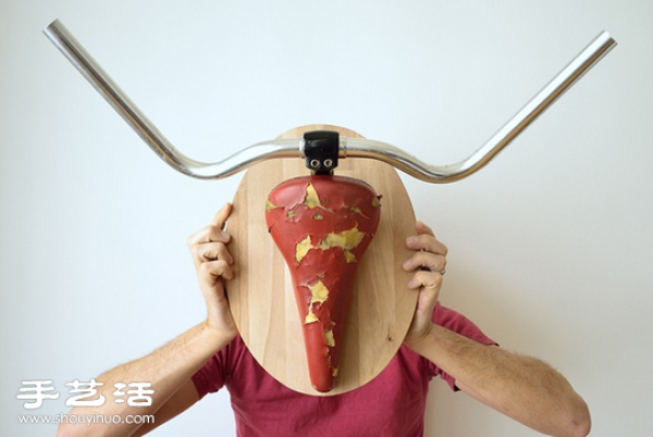 Handmade creative decorative wall hangings using discarded bicycle seats