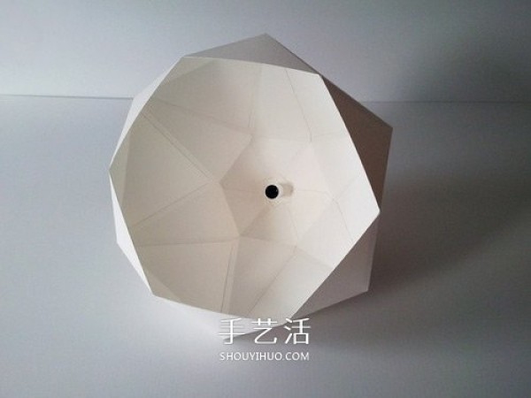 The picture of geometric lampshade made from cardboard is both artistic and futuristic