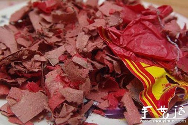 Red envelope made of firecracker debris