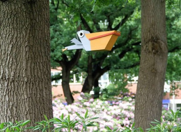 Recycle wood to create a colorful birdhouse for birds to find a place to live