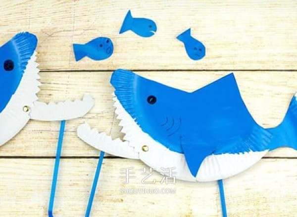 A small shark toy that uses paper dinner plate waste and a movable mouth