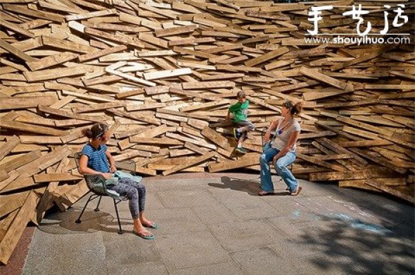 10,000 wooden planks are used to make a DIY birds nest-shaped building