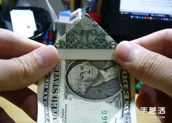 Illustration of the origami method of folding a dollar heart into a dollar bill