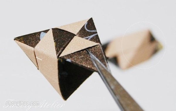 Illustrations of folding origami three-dimensional rhombuses for use as packaging boxes or pendants