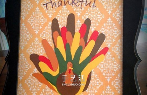 Handmade cute Thanksgiving turkey with cardboard paper-cut palm prints