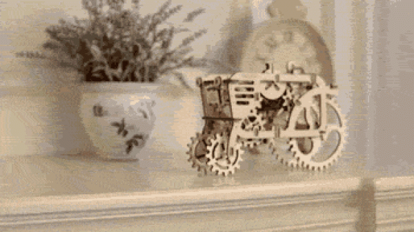 UGEARS self-propelled tractor model production uses rubber bands to generate power