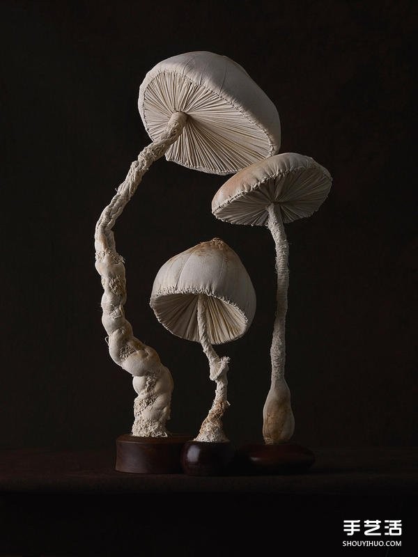 Female master worker "Mr. Bird" sews cloth sculptures of forest-type fungi