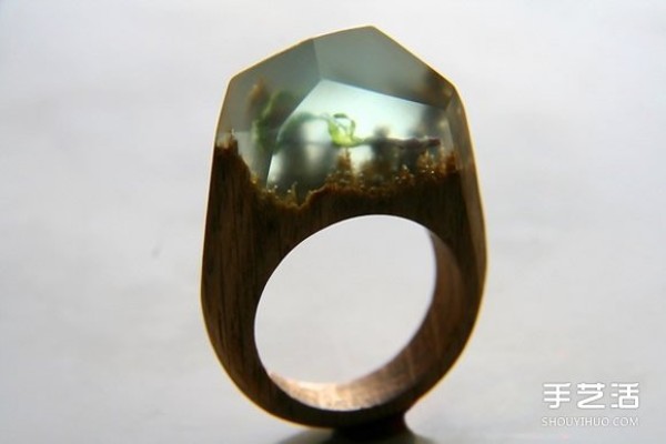 Picture of a handmade resin wood ring with the most beautiful universe in your finger