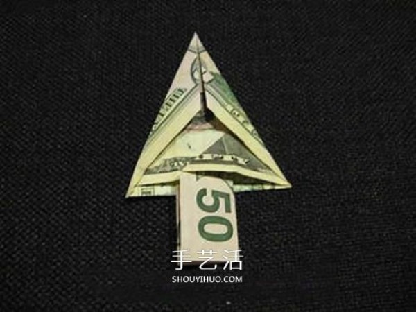 Illustration of how to fold a U.S. dollar Christmas tree. Steps to fold a paper money Christmas tree.