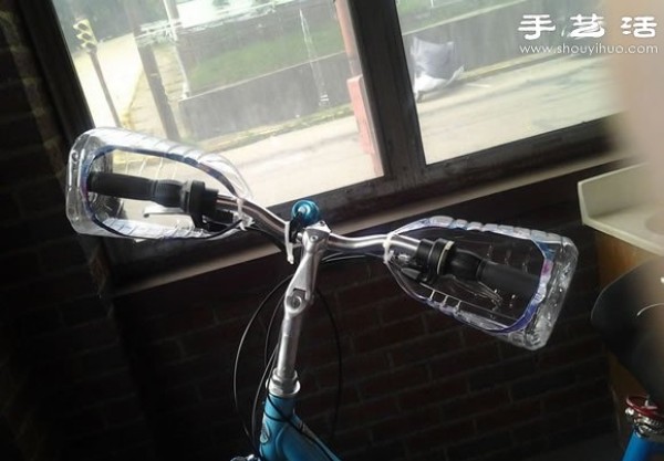 Handmade DIY bicycle handlebar windshield from plastic oil bottles