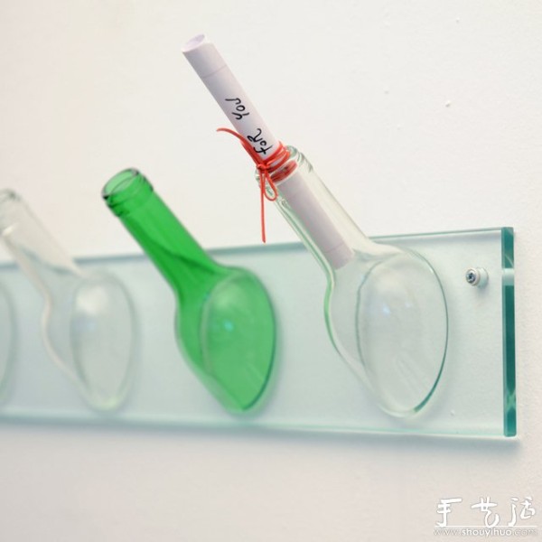 DIY wall hooks using old wine bottles