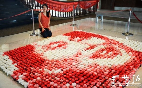 Carnations spell out Aung San Suu Kyi by hand