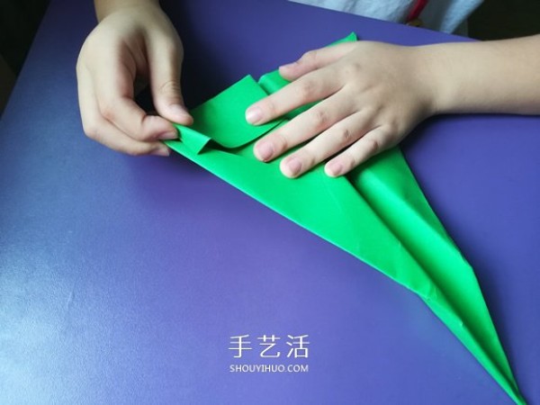 An eight-year-old boys origami sharing an illustrated tutorial on an origami fighter jet