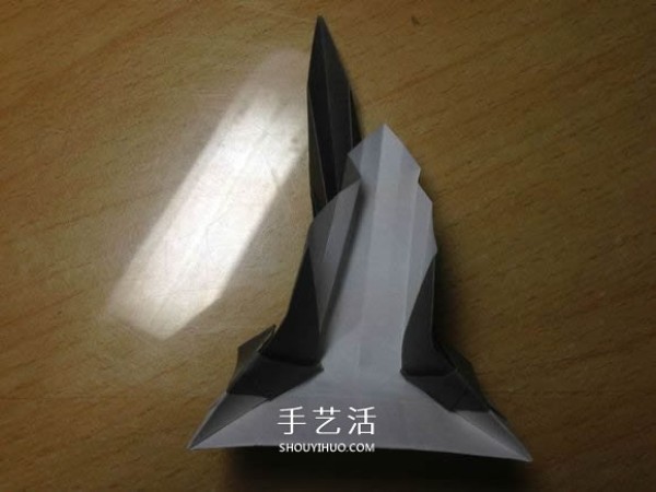 The origami method of an excavator illustrates the folding process of a manual excavator