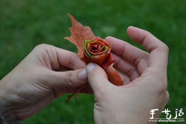 Handmade roses with fiery red maple leaves