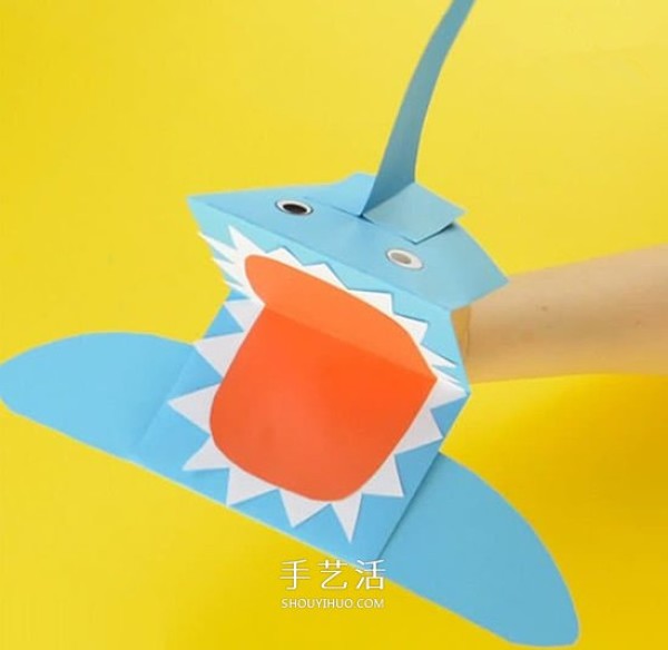 A simple tutorial to make a paper shark and fun origami illustrations of a shark hand puppet