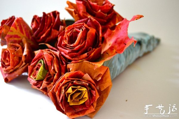 Handmade roses with fiery red maple leaves