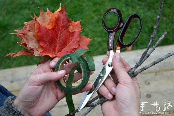 Handmade roses with fiery red maple leaves