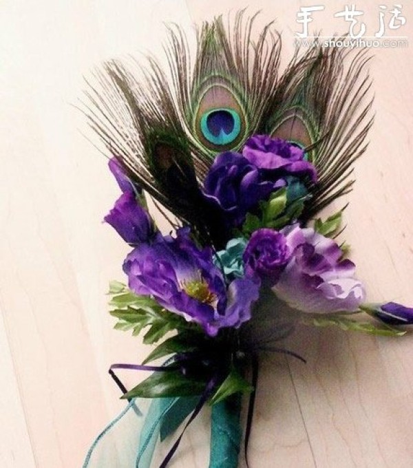 Handmade grooms corsage with peacock feathers