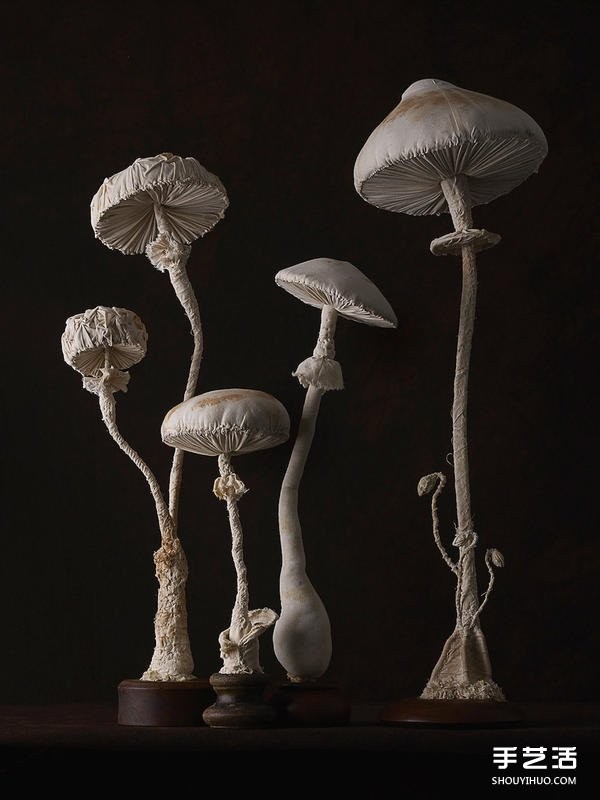 Female master worker "Mr. Bird" sews cloth sculptures of forest-type fungi