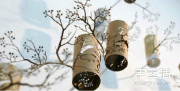 Homemade hanging ornaments: The toilet paper roll is cut out to look like branches.