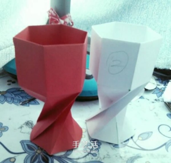 A tutorial on how to fold a simple goblet and a tutorial on how to fold an origami red wine glass