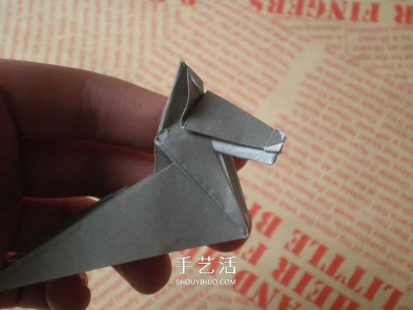 Illustrations of how to fold a cute puppy. Step-by-step pictures of origami puppies.