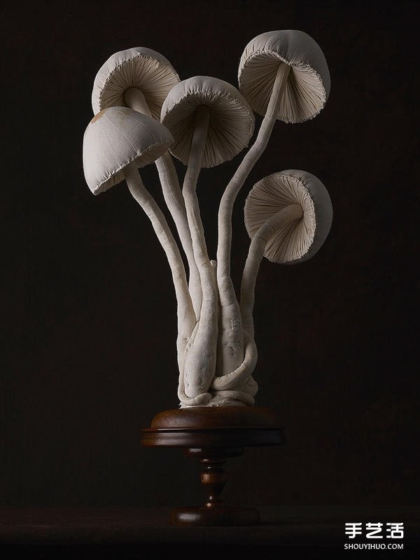 Female master worker "Mr. Bird" sews cloth sculptures of forest-type fungi