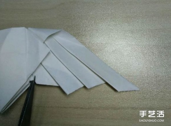 Flying origami heart with steps to fold a heart-shaped with wings