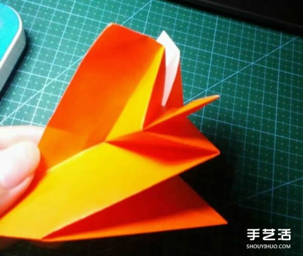 How to make an origami kingfisher with detailed instructions on how to fold a kingfisher