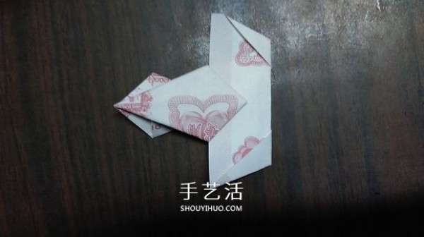 The origami method of the five-petal lotus illustrates the steps of folding the five-petal lotus with paper money