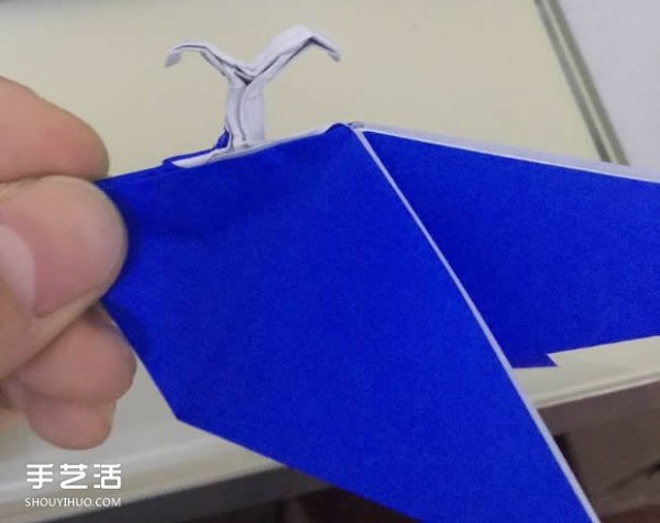 Illustration of the folding method of a spouting whale, step-by-step process of origami three-dimensional whale