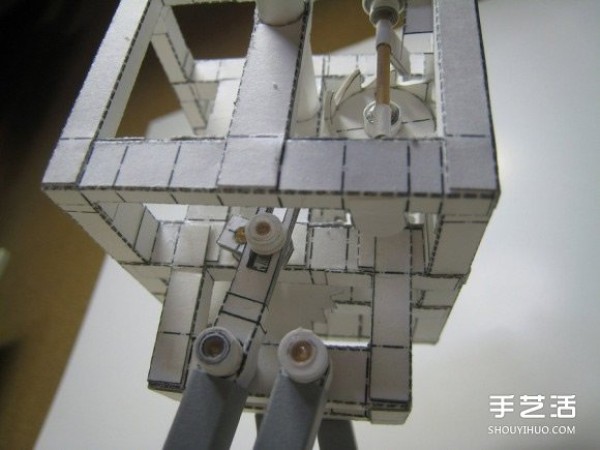 Pictures of hand-made self-driven paper robots model of gear-driven paper robots