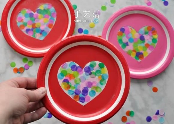 Use paper plates to make Valentines Day love ornaments in just a few simple steps! 