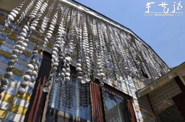 A house decorated with more than 50,000 beer bottles and cans