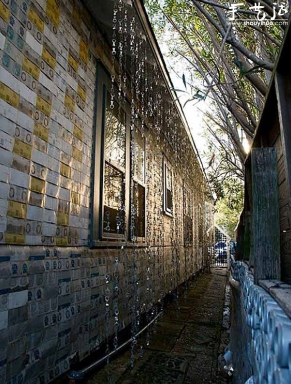 A house decorated with more than 50,000 beer bottles and cans