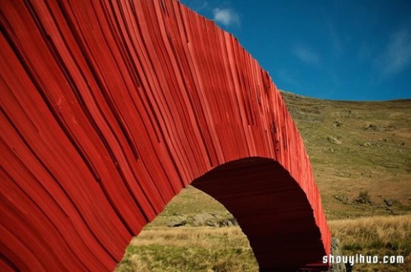 22,000 sheets of paper stacked to create a bridge that requires no glue or nails