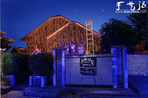 A house decorated with more than 50,000 beer bottles and cans