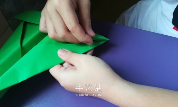 An eight-year-old boys origami sharing an illustrated tutorial on an origami fighter jet