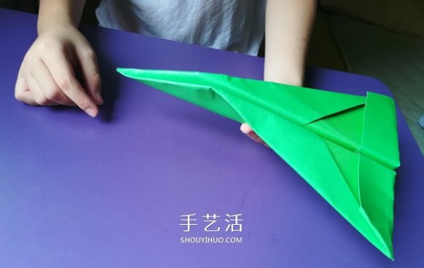 An eight-year-old boys origami sharing an illustrated tutorial on an origami fighter jet