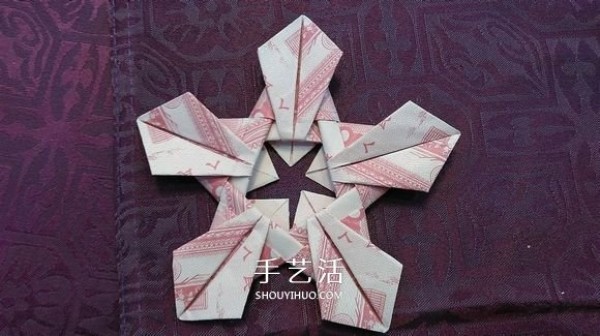 The origami method of the five-petal lotus illustrates the steps of folding the five-petal lotus with paper money