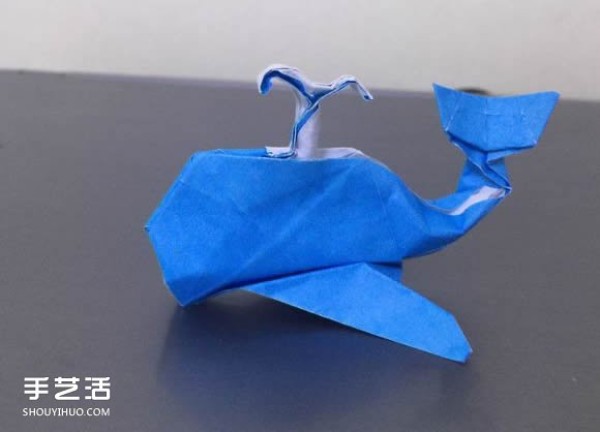 Illustration of how to fold a spouting whale, step-by-step process of origami three-dimensional whale