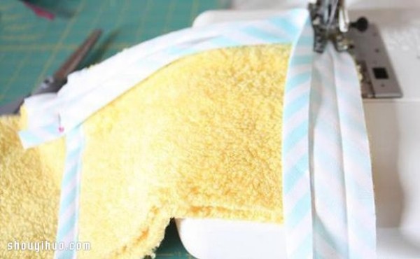 Old towels are repurposed and handmade to make toiletry storage bags